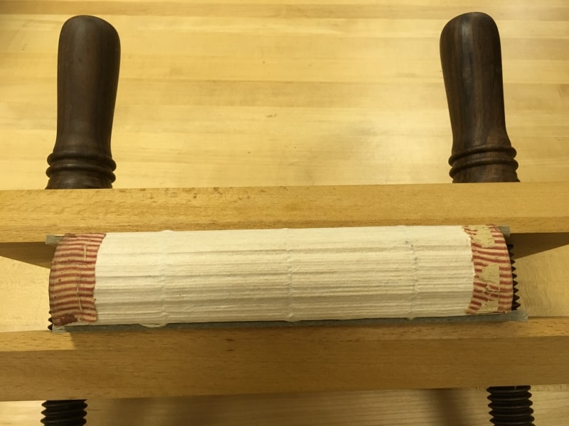 First spine lining of Japanese tissue. Original headbands in place.