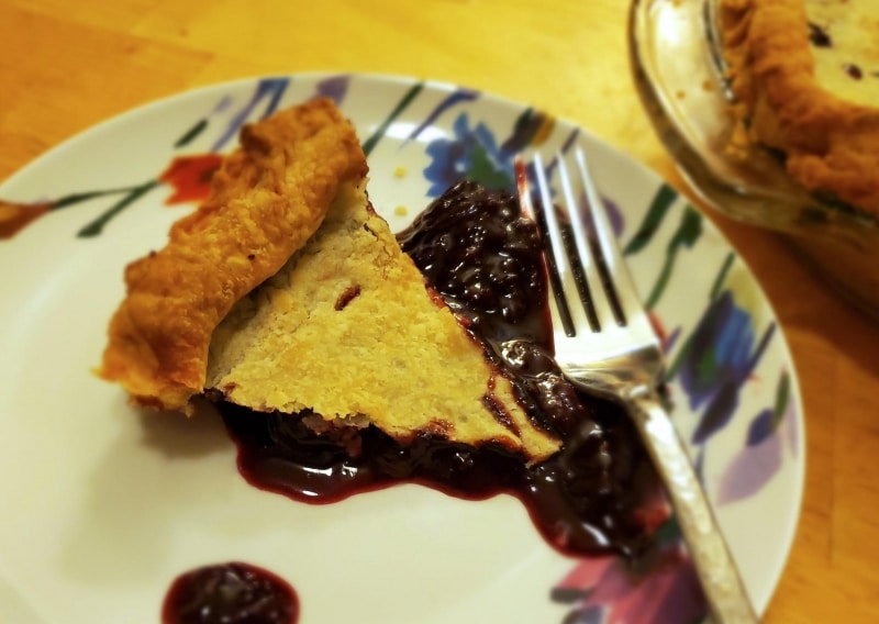 Slice of cherry pie, served