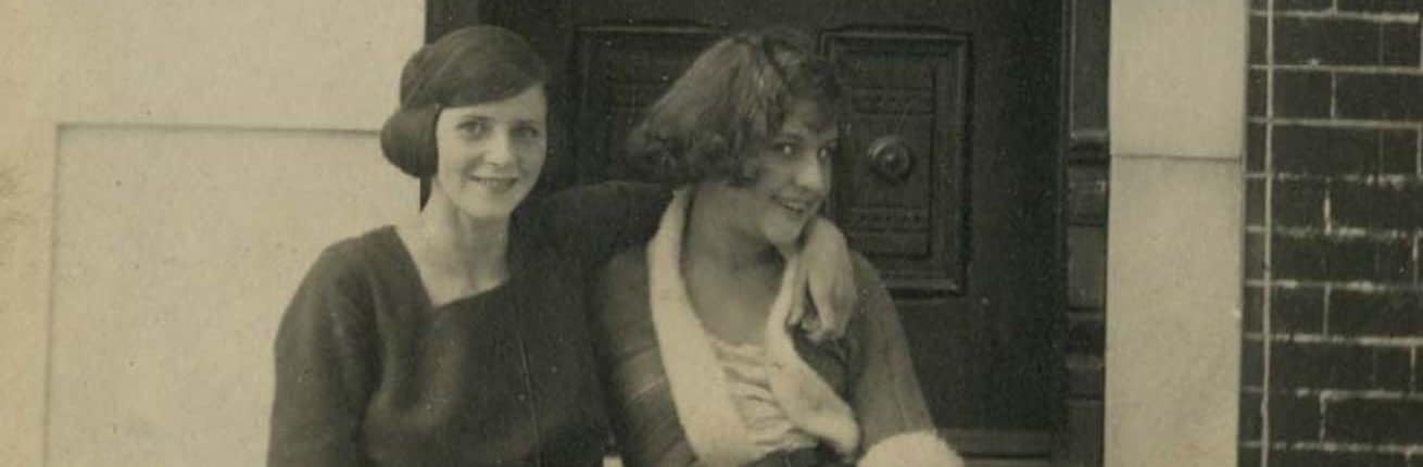 Two women sitting on marble steps in front of door, Philadelphia (ca. 1918). Keith, John Frank. Photographic print : gelatin silver on postcard mount ; 14 x 9 cm. (5.5 x 3.5 in.)