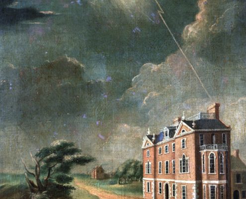 Man walking in a storm while lighting strikes a brick building near trees bending in the wind.