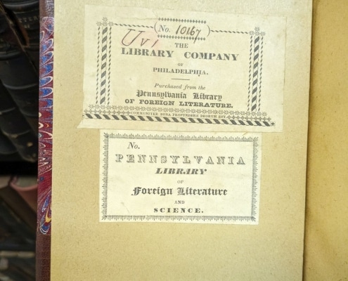 Photograph of inside cover of book with two bookplates