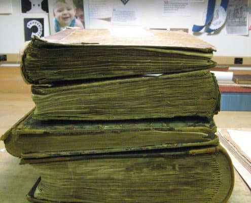 Four rare books in need of boxing.