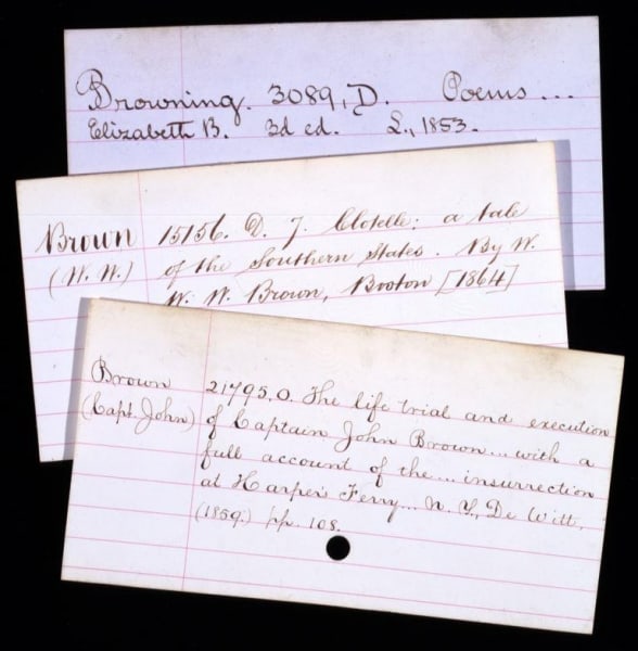 Handwritten cards from the original card catalog, 1876.