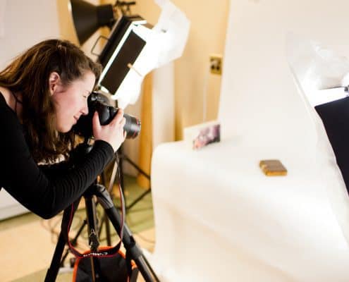 Concetta Barbera, Digital Outreach Librarian and Curatorial Assistant, taking a photograph of a book in the Library Company Digitization Department.