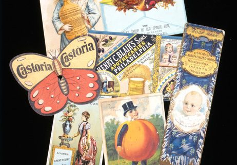 Trade cards depicting a butterfly, a little white girl holding a large bottle, a peach with arms and legs, a white baby, and a bird.
