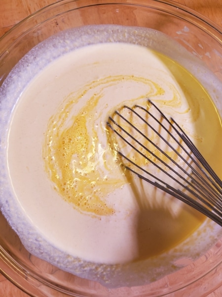 Adding eggs to cream and pumpkin Adding eggs to cream and pumpkin