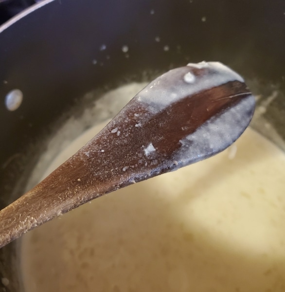 Testing the thickness of the sauce