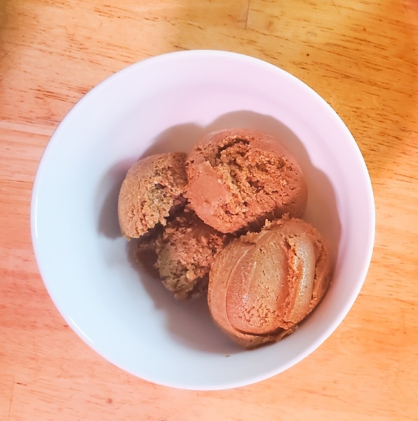 Scoops of caramel frozen dessert in a bowl Scoops of caramel frozen dessert in a bowl