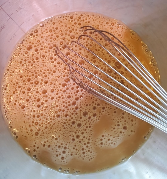 Egg and beef stock, beaten until frothy