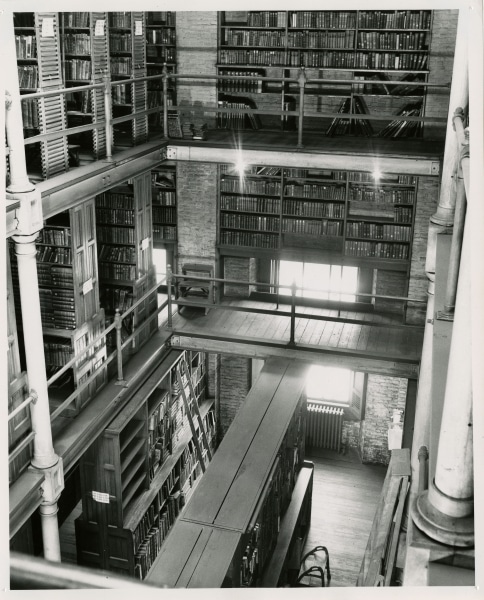 Shelving possibly built by janitor Edward McGrath in the book stacks at the Ridgway Building, ca. 1950s. Gelatin silver print. Shelving possibly built by janitor Edward McGrath in the book stacks at the Ridgway Building, ca. 1950s. Gelatin silver print.