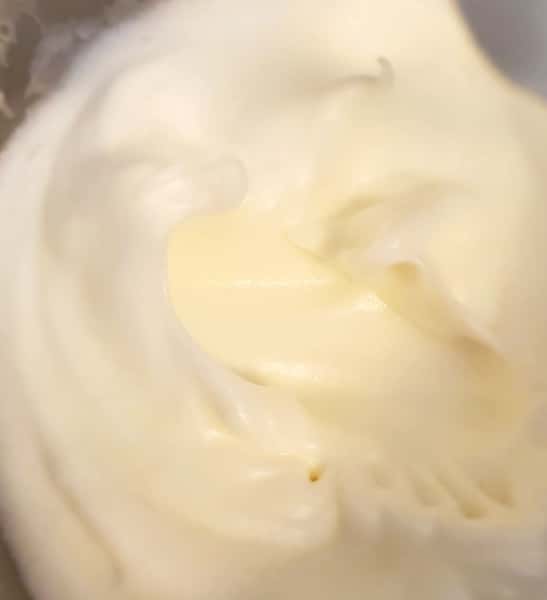 Egg whites whipped into stiff peaks